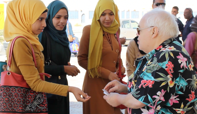 Even female university students were eager to take my AIDS prevention business cards that have the basic medical facts and my contact indormation. They are surprised that I come as a volunteer and am not paid to spread the word. I ask them to help.
